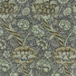 Floral patterned fabric with green and brown flowers on a dark background