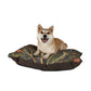 Dog sitting on a decorative dog bed with a William Morris & Co nature-themed pattern on a white background