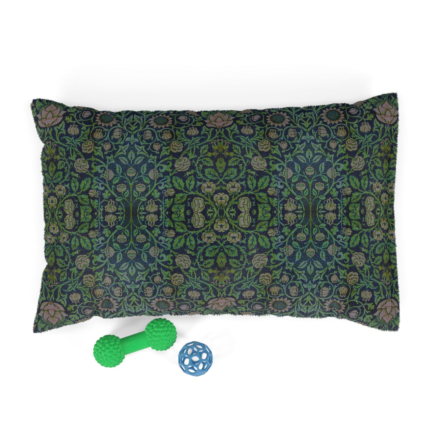 Decorative dog pillow with William Morris & Co floral pattern and two pet toys on a white background