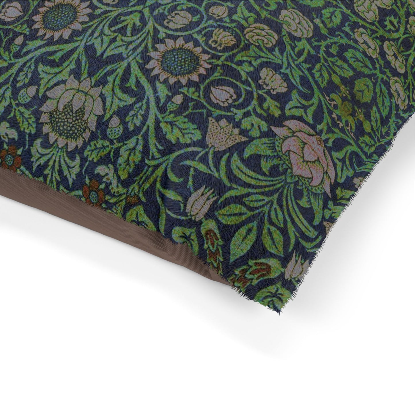 Floral patterned dog bed with William Morris & Co green and blue colours on a white background