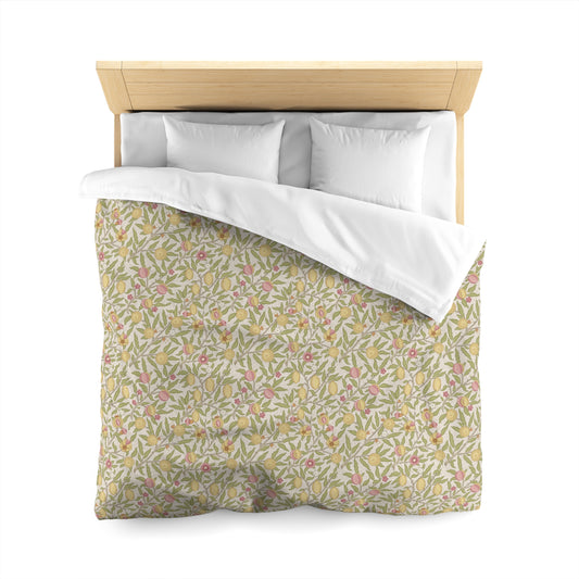 Floral patterned duvet cover on a bed with white pillows and wooden headboard.