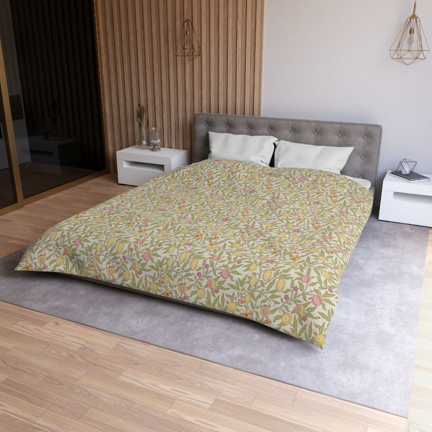 Bedroom with a bed featuring a floral duvet cover, white nightstands, and wooden flooring.