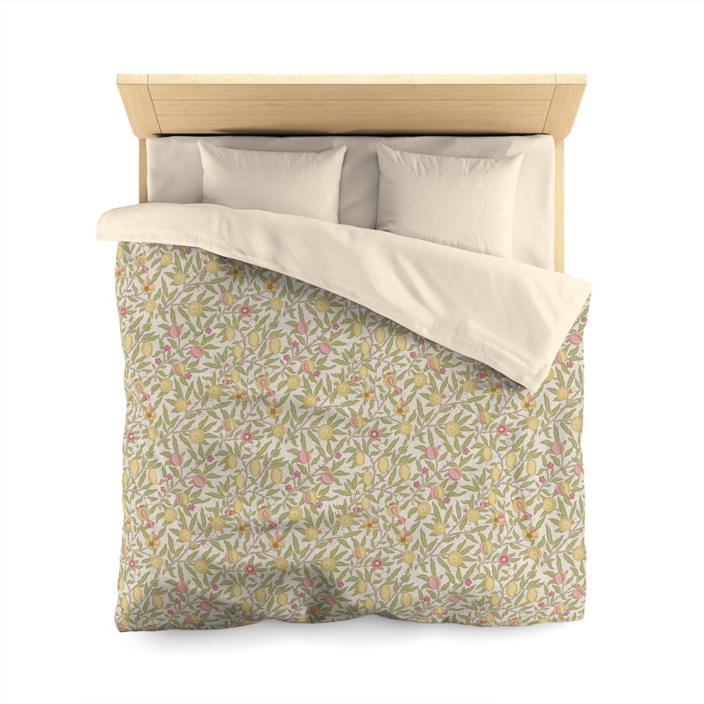 Floral patterned duvet cover with beige pillows on a wooden bed frame.
