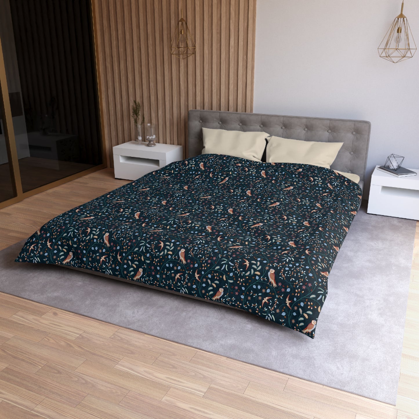 Bed with patterned duvet cover in a modern bedroom setting