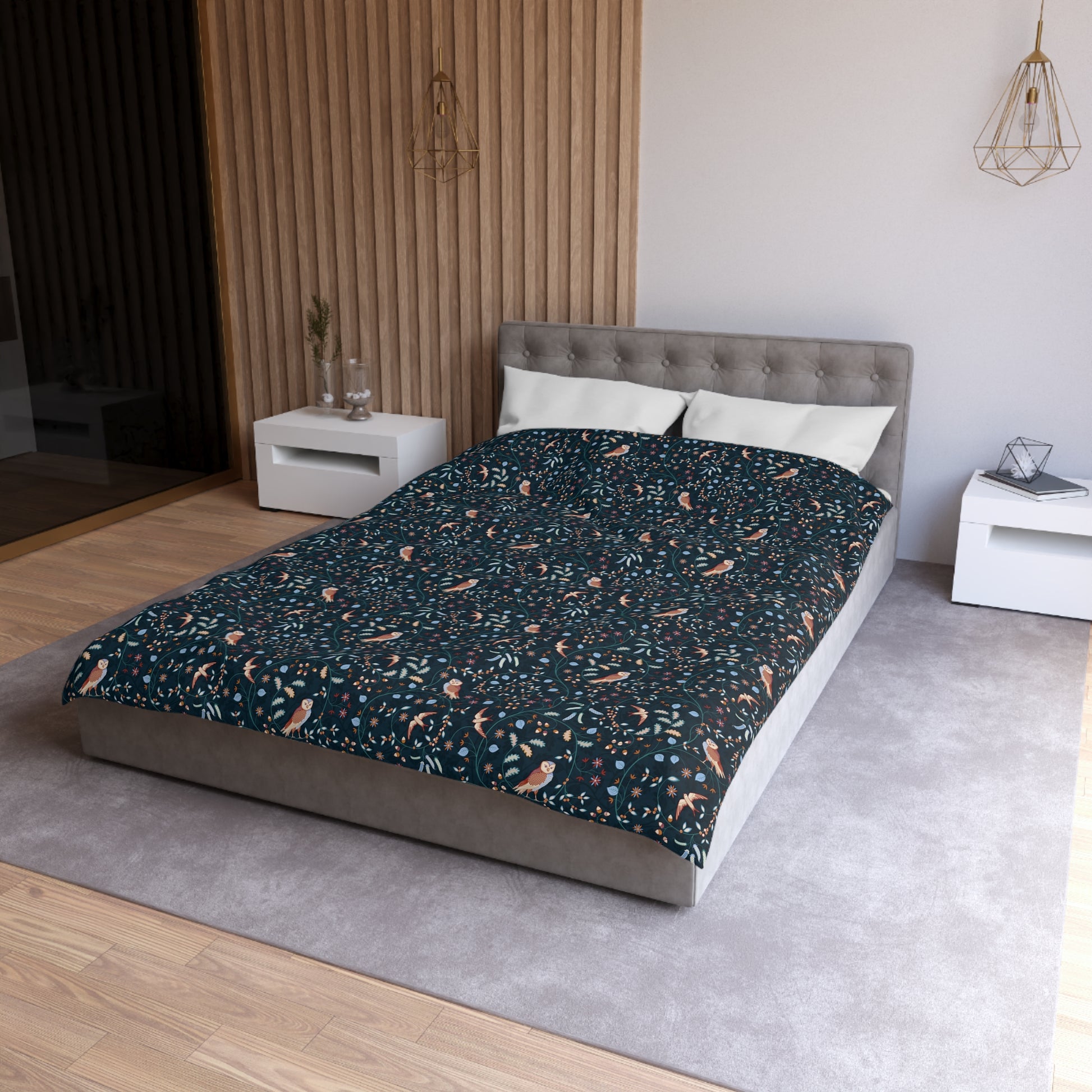 Bed with patterned duvet cover in a modern bedroom setting