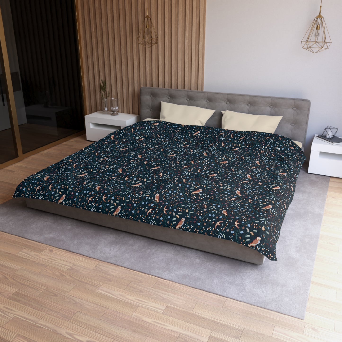 Bed with a patterned comforter in a bedroom setting