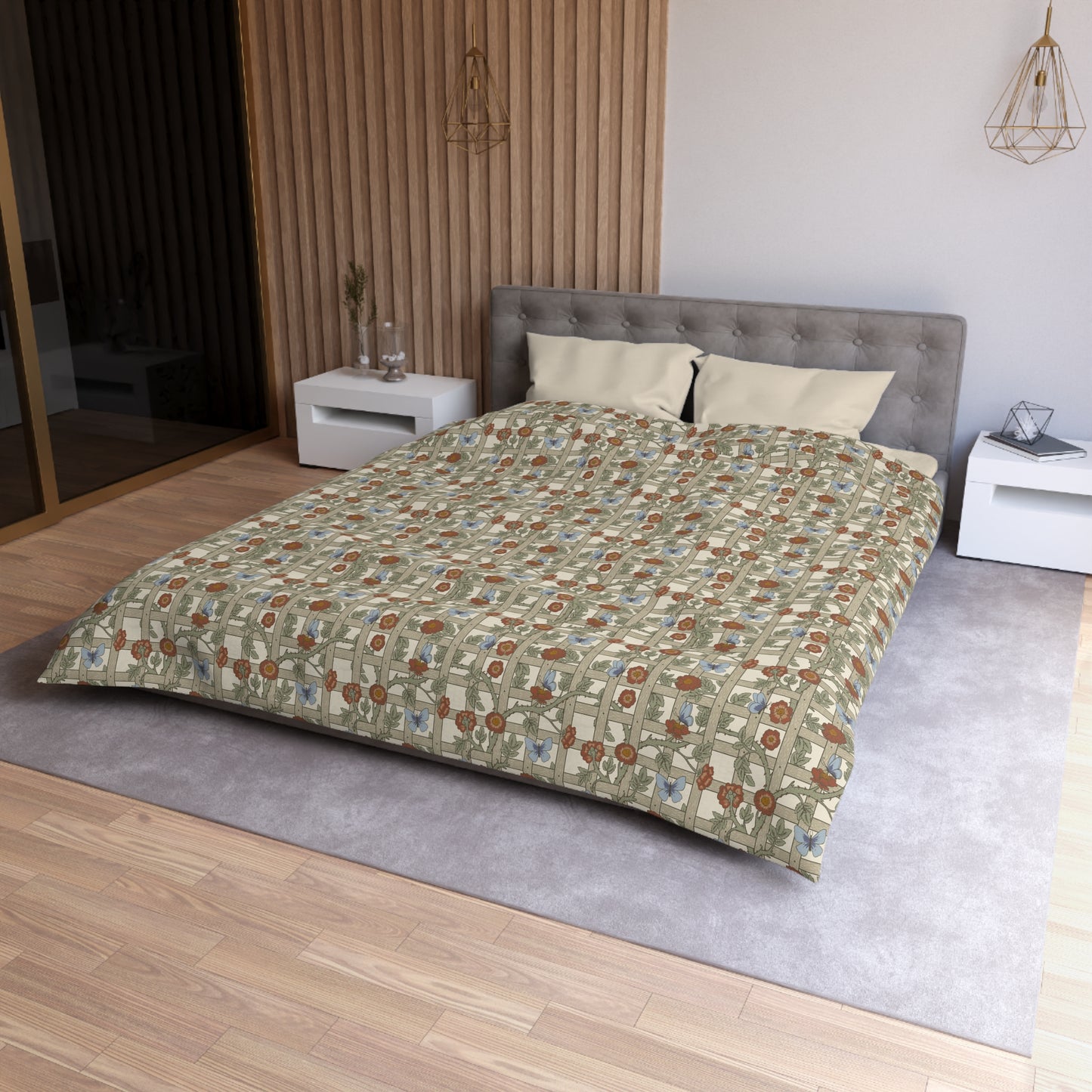 Bedroom with a bed featuring a patterned duvet cover, gray headboard, and white nightstands.