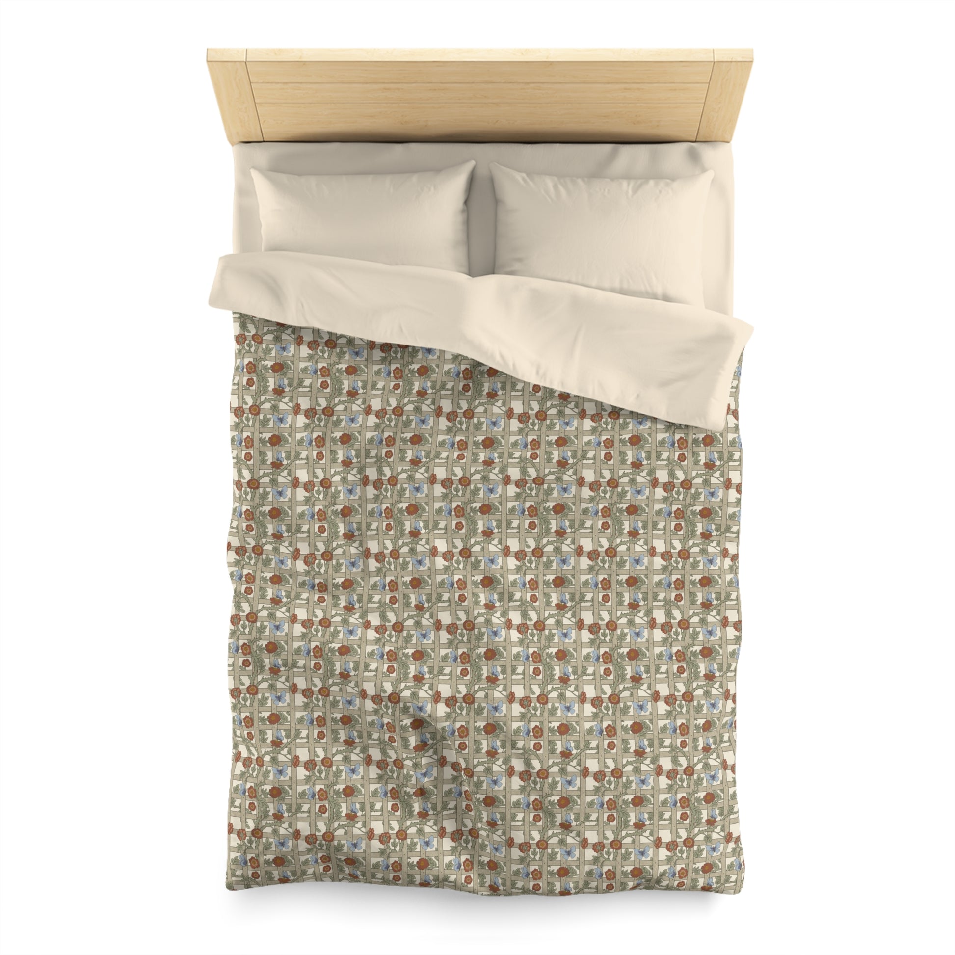 Patterned duvet cover with beige pillow shams on a bed with wooden headboard.
