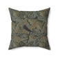 A square-shaped faux suede cushion with a William Morris & Co floral pattern in shades of grey, green, and beige.