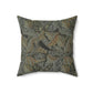 A square-shaped faux suede cushion with a William Morris & Co floral pattern in shades of grey, green, and beige.