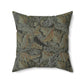 A square-shaped faux suede cushion with a William Morris & Co floral pattern in shades of grey, green, and beige.