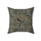A square-shaped faux suede cushion with a William Morris & Co floral pattern in shades of grey, green, and beige.