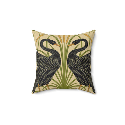 A square-shaped throw pillow with a double-sided print featuring black swans on a beige background with green leaf William Morris & Co patterns.