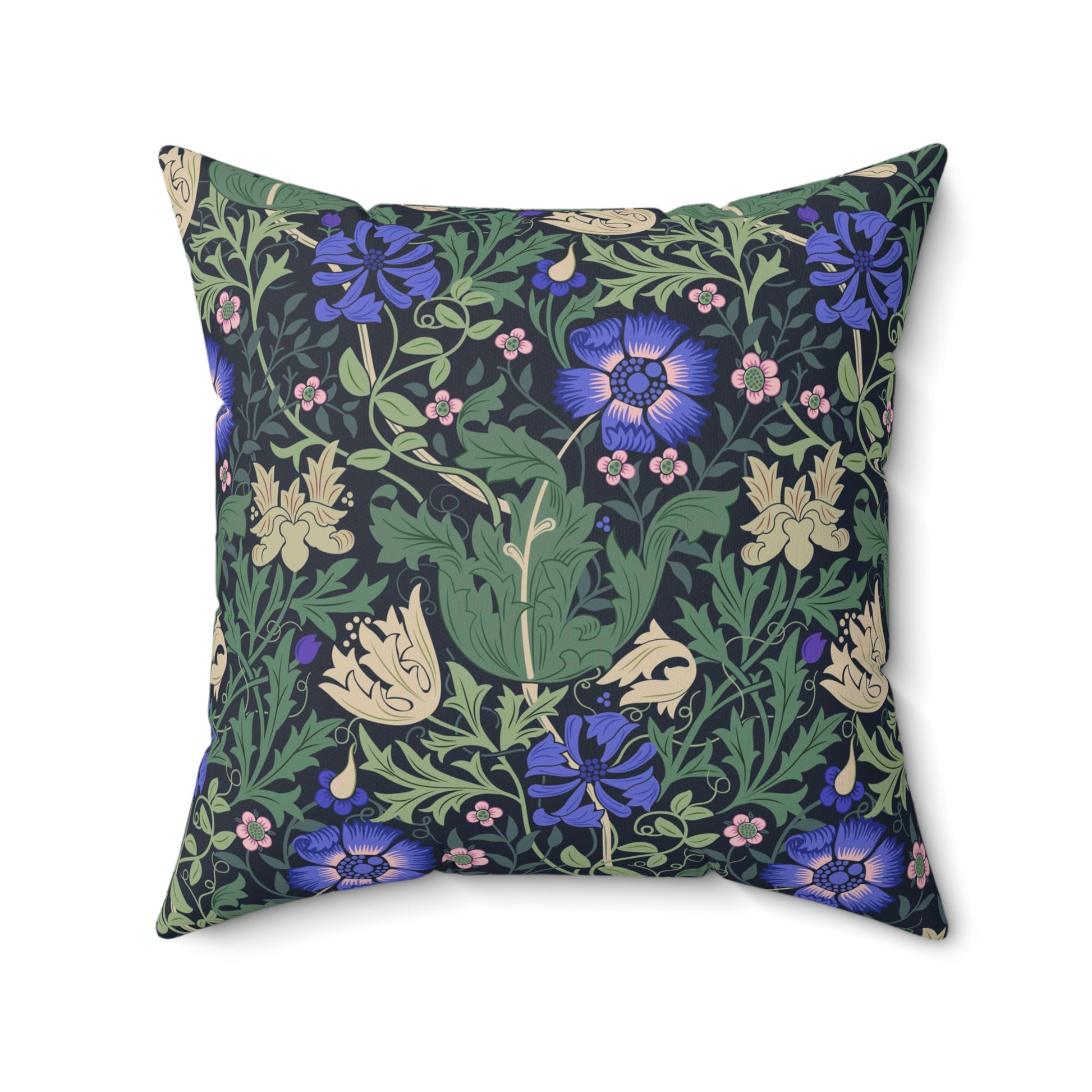 A square-shaped faux suede cushion with a floral William Morris & Co pattern featuring blue flowers and green leaves on a dark background called Compton.