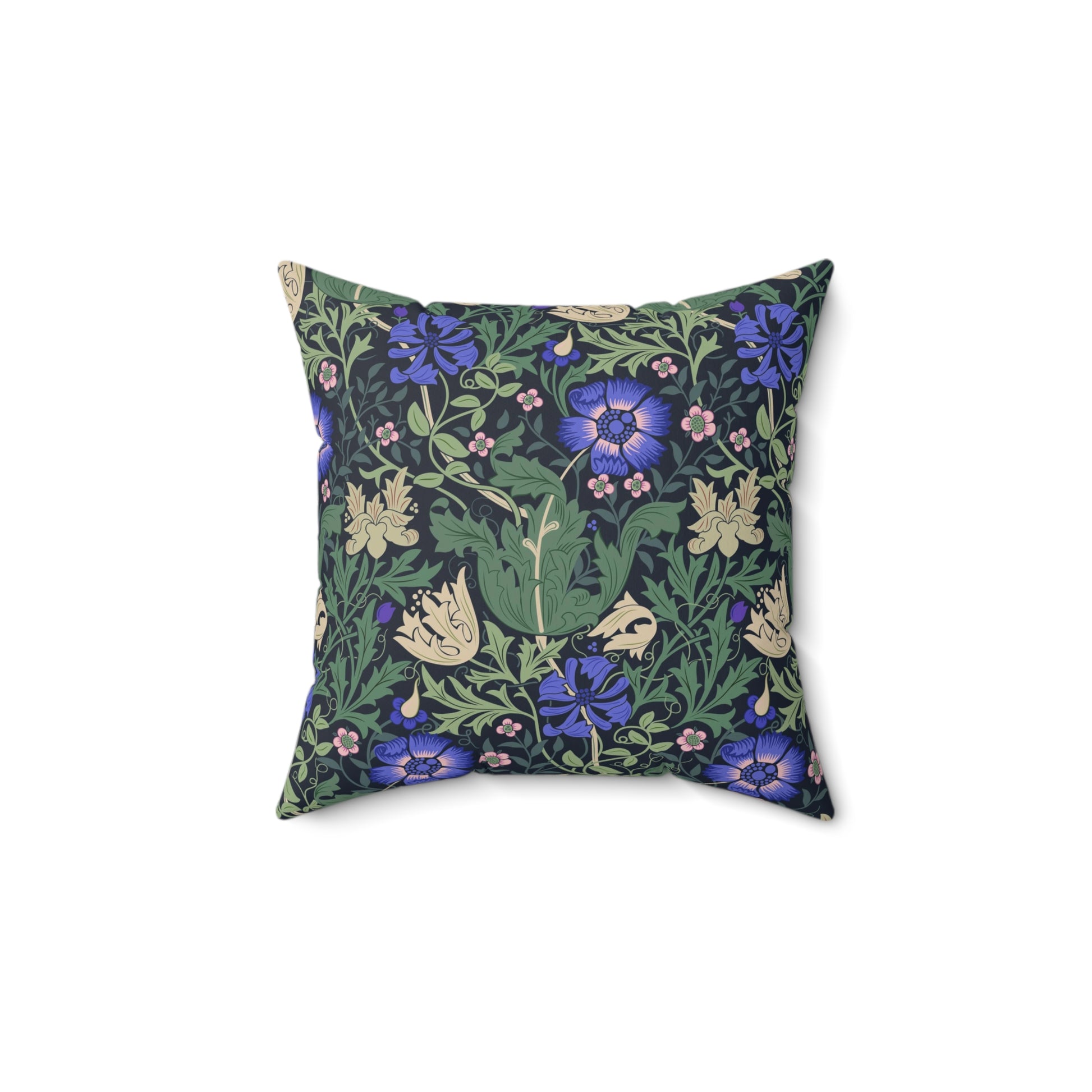 A square-shaped faux suede cushion with a floral William Morris & Co pattern featuring blue flowers and green leaves on a dark background called Compton.
