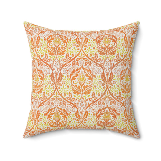 A square-shaped cushion with a geometric William Morris & Co pattern featuring orange and yellow hues on a white background.