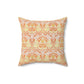 A square-shaped cushion with a geometric William Morris & Co pattern featuring orange and yellow hues on a white background.
