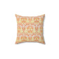 A square-shaped cushion with a geometric William Morris & Co pattern featuring orange and yellow hues on a white background.