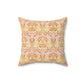 A square-shaped cushion with a geometric William Morris & Co pattern featuring orange and yellow hues on a white background.