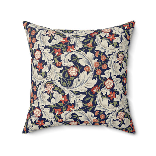 A square-shaped cushion with a William Morris & Co floral pattern called Leicester featuring red, blue and green colours on a white background.