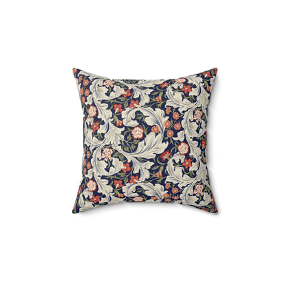 A square-shaped cushion with a William Morris & Co floral pattern called Leicester featuring red, blue and green colours on a white background.