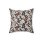 A square-shaped cushion with a William Morris & Co floral pattern called Leicester featuring red, blue and green colours on a white background.
