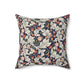 A square-shaped cushion with a William Morris & Co floral pattern called Leicester featuring red, blue and green colours on a white background.