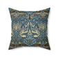 A square-shaped throw pillow with a  William Morris & Co floral and peacock design on a dark blue background with a visible concealed zipper.