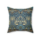 A square-shaped throw pillow with a  William Morris & Co floral and peacock design on a dark blue background with a visible concealed zipper.