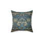 A square-shaped throw pillow with a  William Morris & Co floral and peacock design on a dark blue background with a visible concealed zipper.