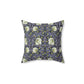 A square-shaped faux suede cushion with an floral William Morris & Co pattern called Pimpernel in shades of purple, green and yellow.