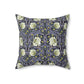 A square-shaped faux suede cushion with an floral William Morris & Co pattern called Pimpernel in shades of purple, green and yellow.