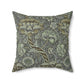 A square-shaped faux suede cushion with a William Morris & Co floral pattern in shades of gray and green called Wandle.