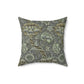 A square-shaped faux suede cushion with a William Morris & Co floral pattern in shades of gray and green called Wandle.