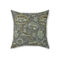 A square-shaped faux suede cushion with a William Morris & Co floral pattern in shades of gray and green called Wandle.