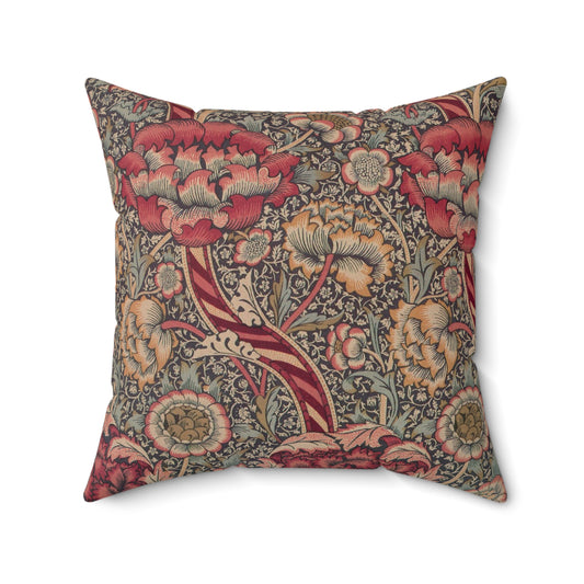 A square-shaped cushion with a floral William Morris & Co pattern called Wandle in red, beige, and darker shades of red on a darker background.