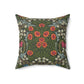 A square-shaped faux suede cushion with a floral pattern inspired by William Morris, featuring a green background with red and white flowers.