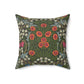 A square-shaped faux suede cushion with a floral pattern inspired by William Morris, featuring a green background with red and white flowers.