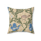 A square-shaped throw pillow with an all-over print featuring a bird, floral William Morris & Co patterns, and blue irises on a beige background.