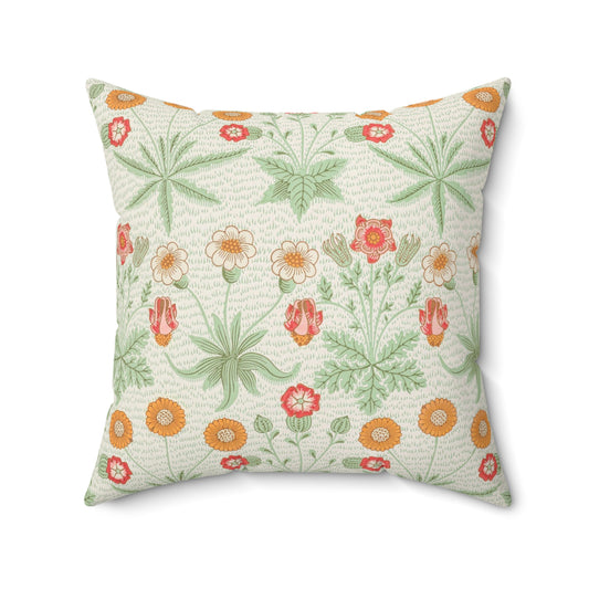 A square faux suede cushion with a floral pattern in shades of green, orange, and pink.