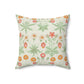 A square faux suede cushion with a floral pattern in shades of green, orange, and pink.