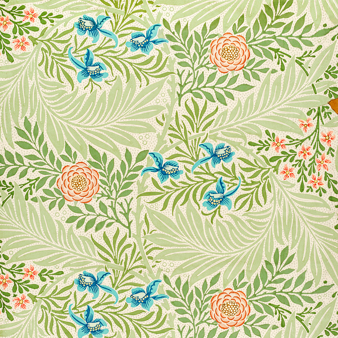 A square-shaped faux suede cushion with an all-over print featuring a William Morris & Co floral pattern in shades of green, blue, and orange.