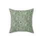 A square-shaped faux suede cushion with a floral pattern, primarily in green and white, on a white background.