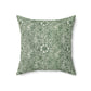 A square-shaped faux suede cushion with a floral pattern in a green color, featuring a concealed zipper.