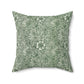 A square-shaped faux suede cushion with a floral pattern in a green colour, inspired by William Morris - Marigold Collection.