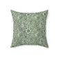 A square-shaped faux suede cushion with a floral pattern in a green colour, inspired by William Morris - Marigold Collection.