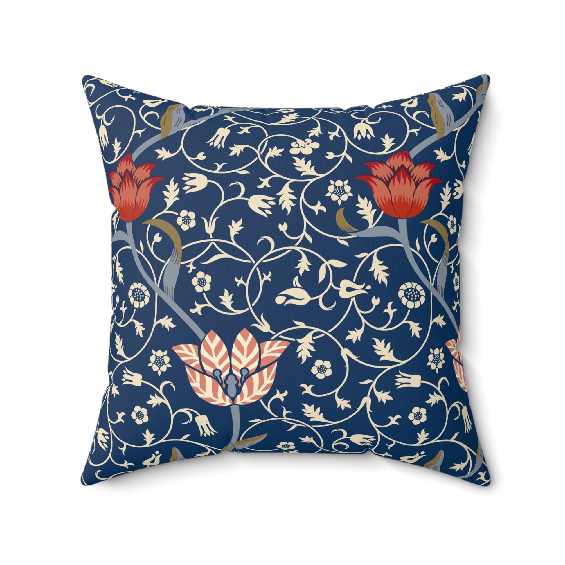 A square-shaped faux suede cushion with a floral pattern inspired by William Morris, predominantly in blue with red and white accents.