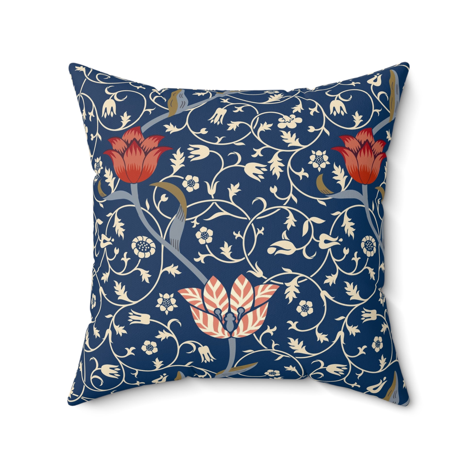A square-shaped faux suede cushion with a floral pattern inspired by William Morris, predominantly in blue with red and white accents.