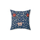 A square-shaped faux suede cushion with a floral pattern inspired by William Morris, predominantly in blue with red and white accents.