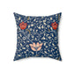 A square-shaped faux suede cushion with a floral pattern inspired by William Morris, predominantly in blue with red and white accents.